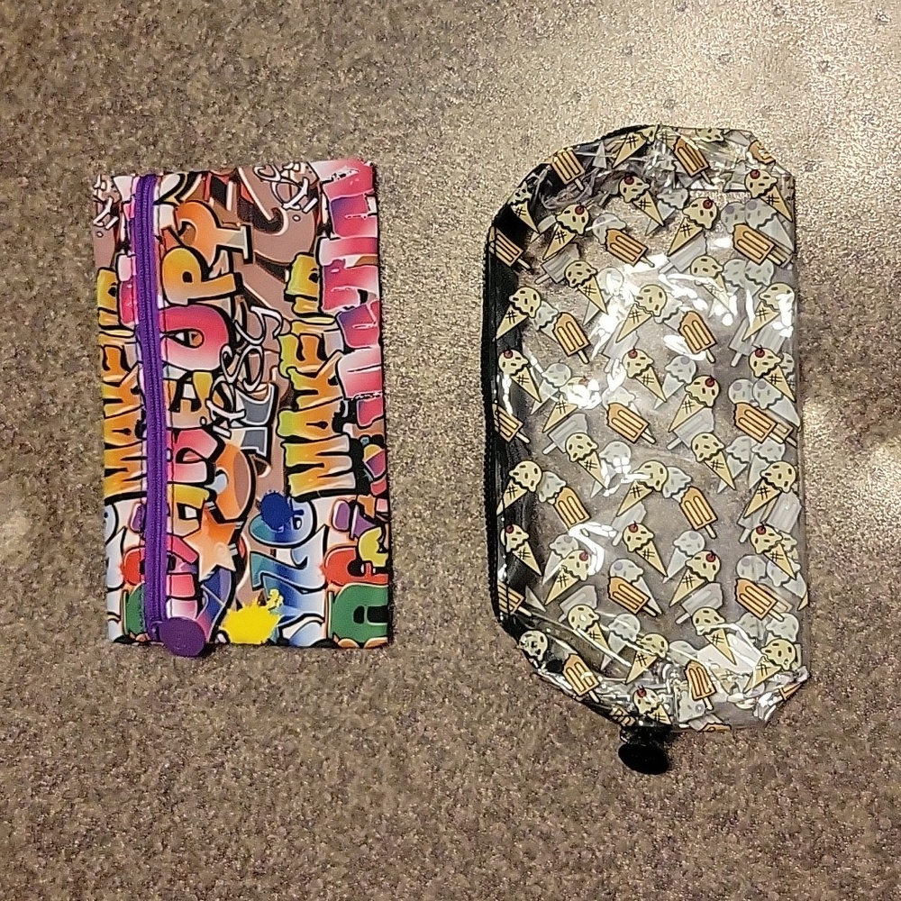 Two Ipsy small cosmetic bags